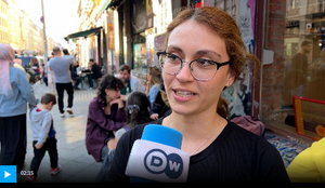 young Turkish woman being interviewed on a Berlin street