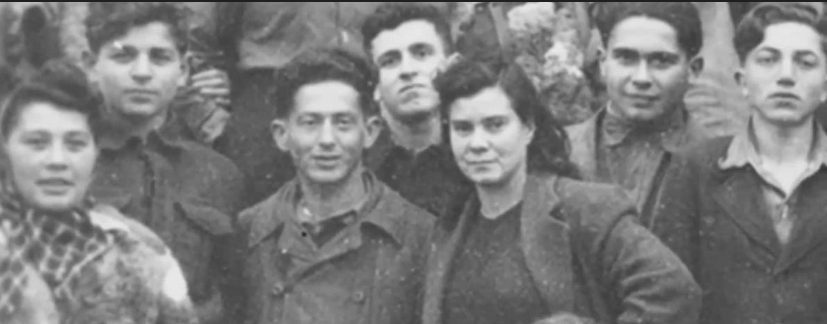 Holocaust survivors posing for a camera in Landsberg's DP camp