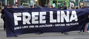 Demonstrators holding up a 'Free Lina' banner