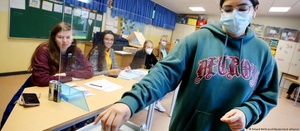 a young voter casting her ballot