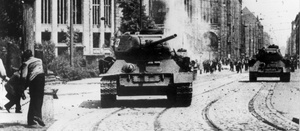 GDR protesters throwing stones at a Soviet tank