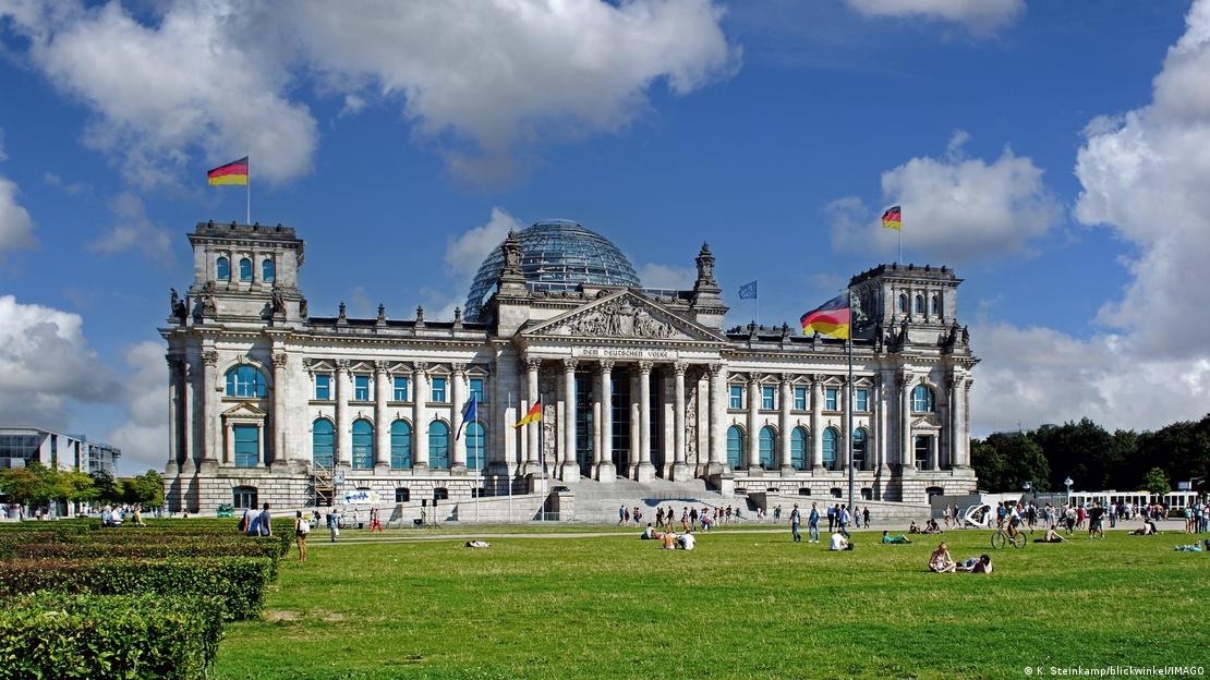 Reichstag with national flags on a summer day