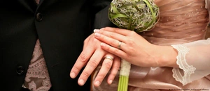 hands of bride and groom with rings