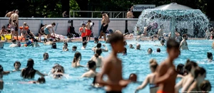 an outdoor swimming pool in the summer